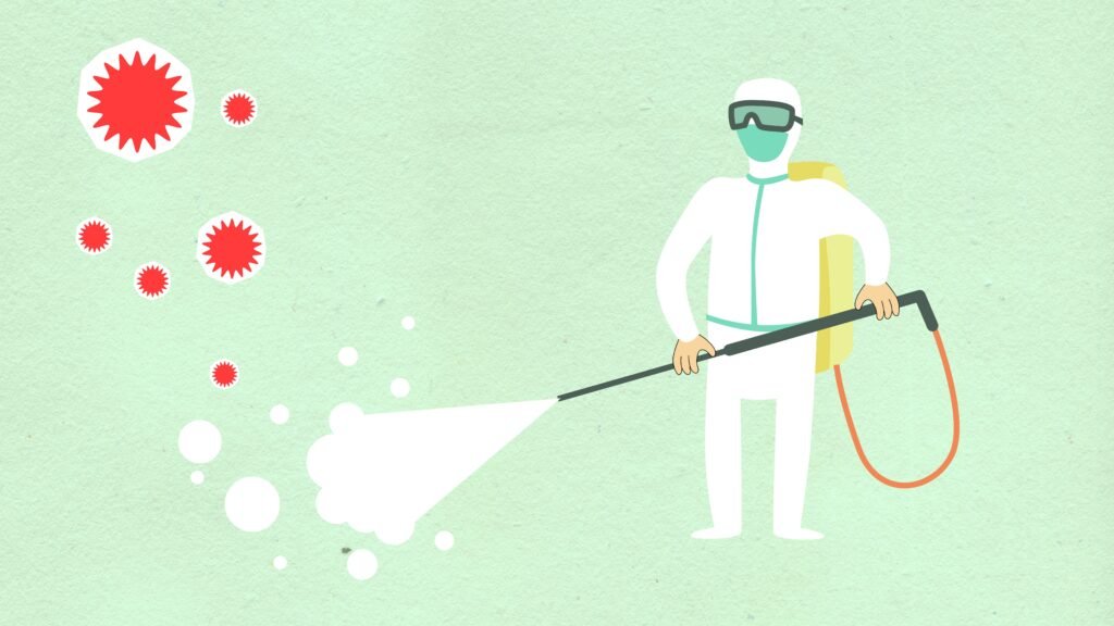 Decorative paper appliques of cleaning person in protective equipment spraying disinfectant during COVID 19 pandemic on green background